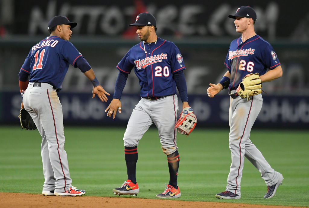 Jorge Polanco, Eddie Rosario, and Max Kepler celebrating a win