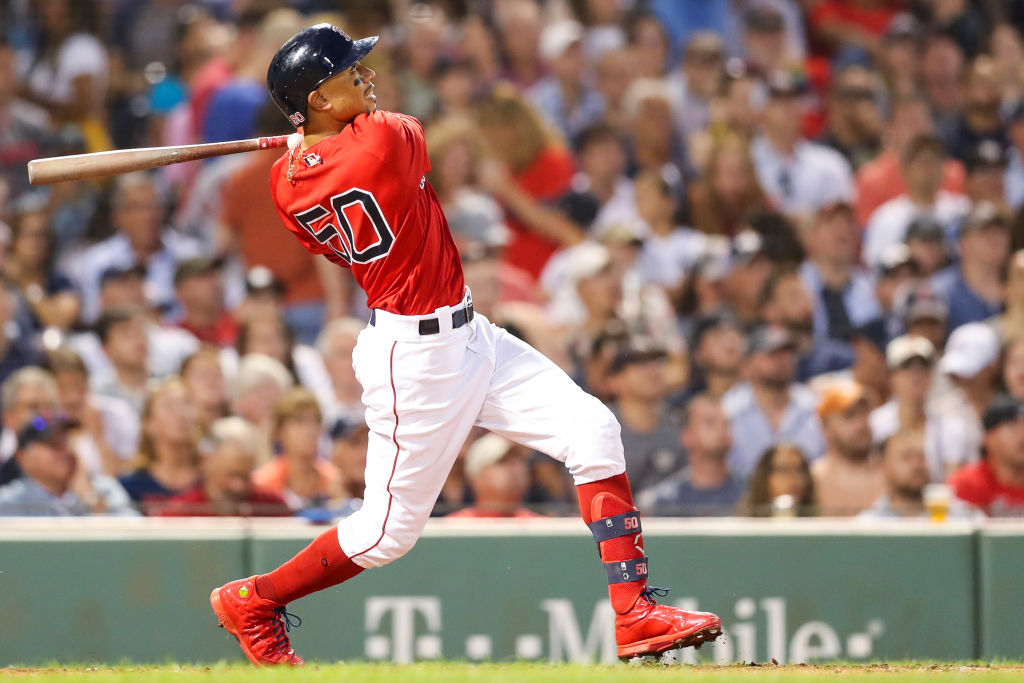 Mookie Betts #50 of the Boston Red Sox hits a two-run home run