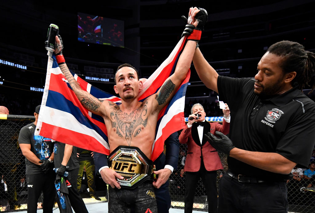 Max Holloway celebrates after defeating Frankie Edgar