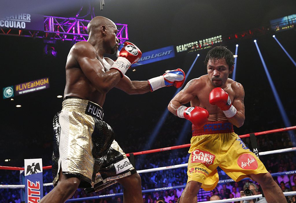 Floyd Mayweather Jr. exchanges punches with Manny Pacquiao