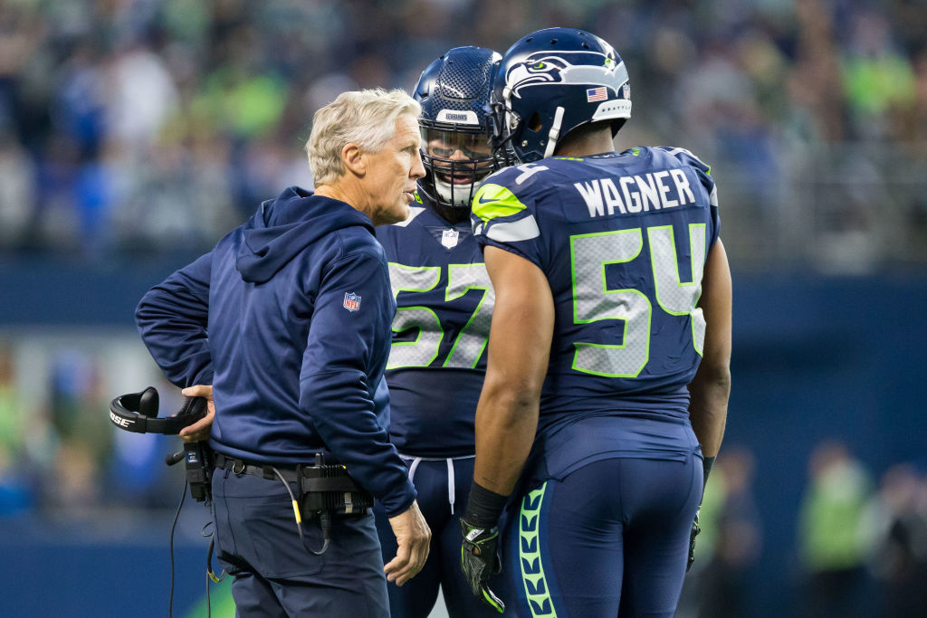 Pete Carroll strategizes with Bobby Wagner