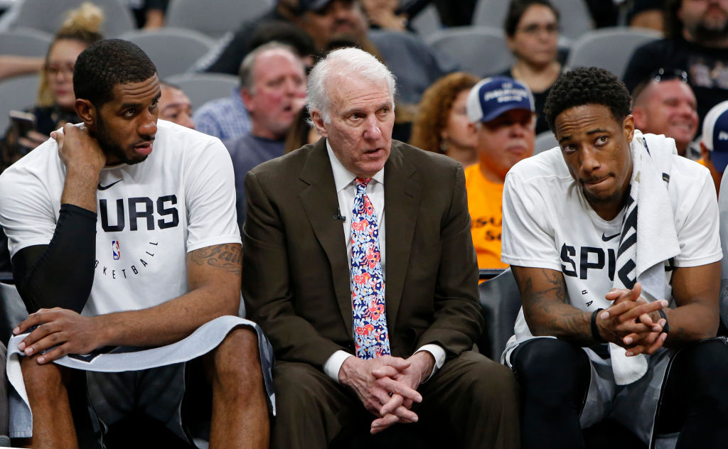 Under Gregg Popovich (middle), the Spurs are almost guaranteed to make the NBA playoffs.