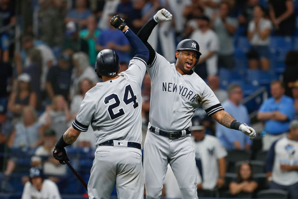 Aaron Hicks (right) and Gary Sanchez helped the Yankees set an MLB record for consecutive games with a home run.