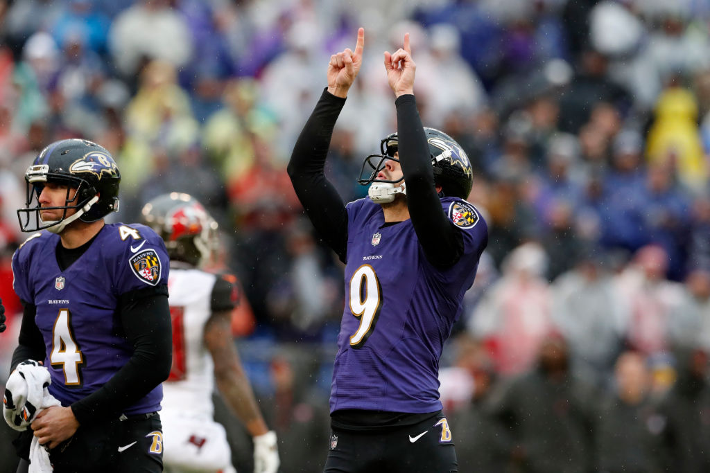 Kicker Justin Tucker #9 of the Baltimore Ravens reacts after kicking