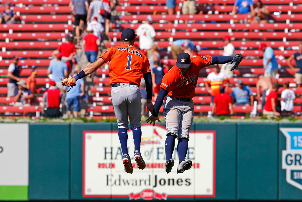 Carlos Correa and George Springer celebrate a win