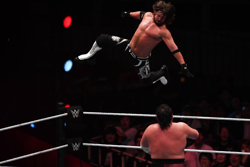 AJ Styles delivering a phenomenal forearm to Samoa Joe
