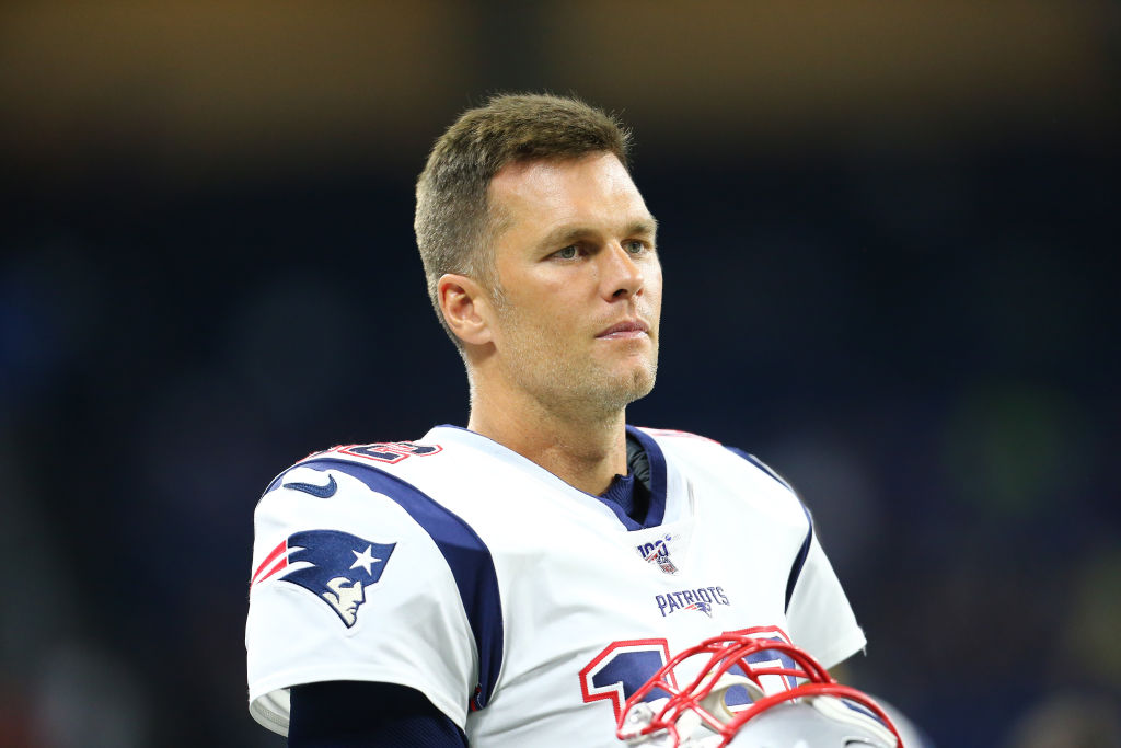 Tom Brady #12 of the New England Patriots looks on during the preseason