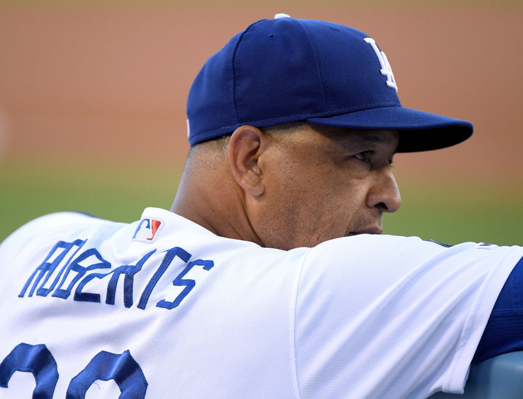 Dave Roberts #30 of the Los Angeles Dodgers looks on