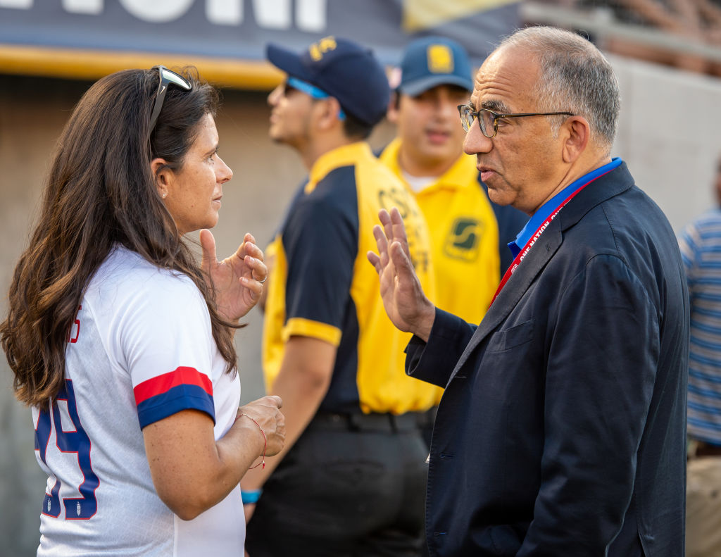 USWNT legend Mia Hamm and Carlos Cordiero having a discussion