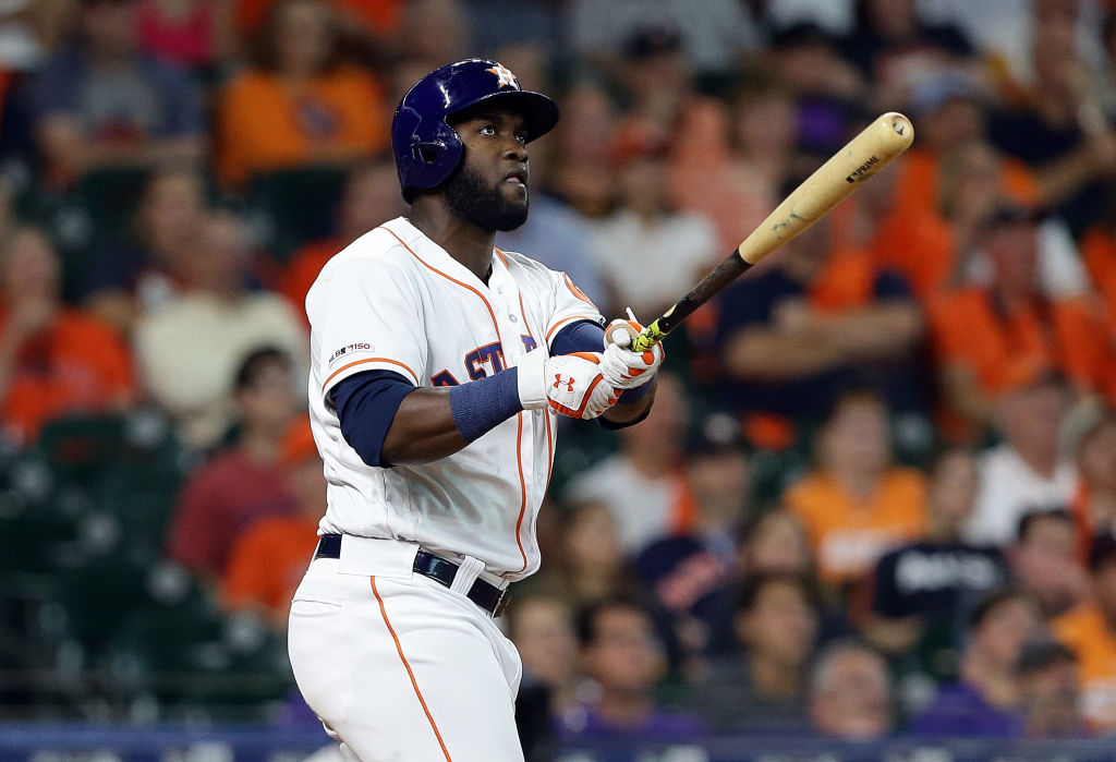 Yordan Alvarez watching his two-run home run leave the park