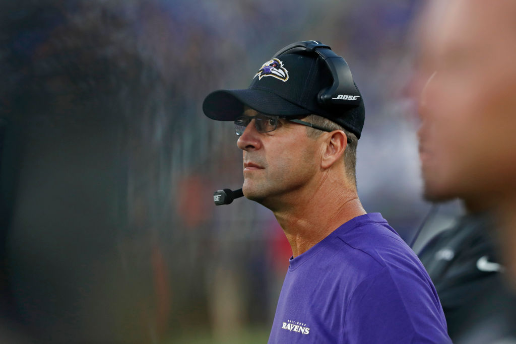 Head Coach John Harbaugh of the Baltimore Ravens looks on