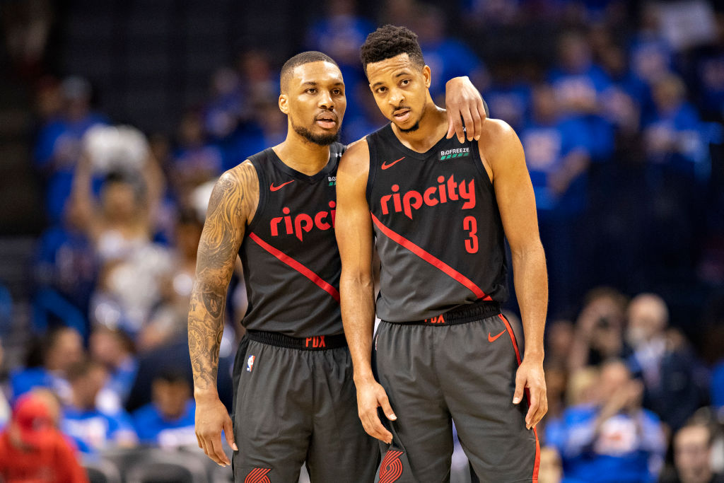 CJ McCollum (right) chose resigning with the Trail Blazers and playing alongside Damian Lillard instead of testing free agency.