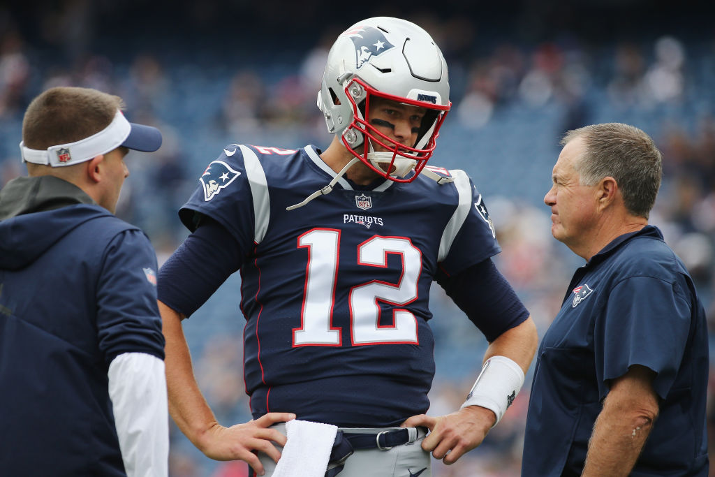 The Patriots traded for two offensive linemen in order to protect Tom Brady (middle) and bolster their Super Bowl chances.