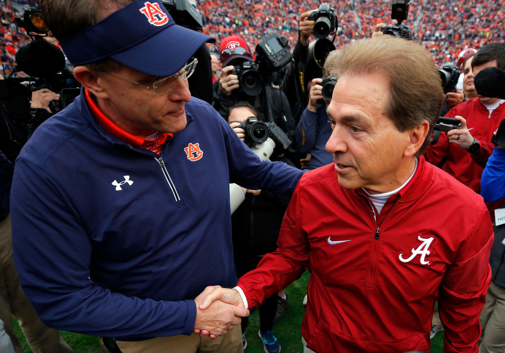 Auburn coach Gus Malzahn (left) took a verbal jab at Nick Saban (right) and in-state rival Alabama.