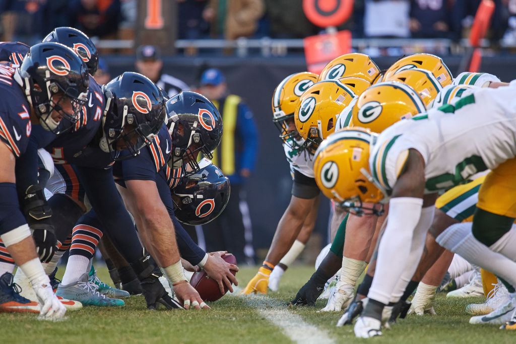 Chicago Bears vs the Green Bay packers line up on the field to start a play