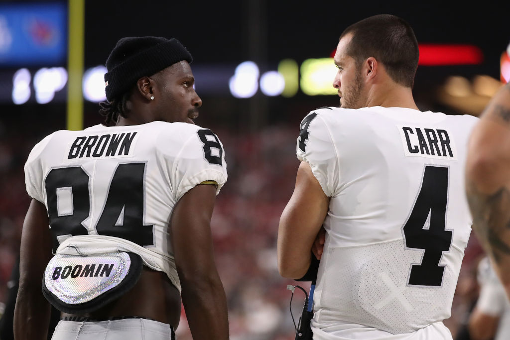 He never used it, but Raiders quarterback Derek Carr (right) received some advice about playing with superstar wide receivers like Antonio Brown (left).
