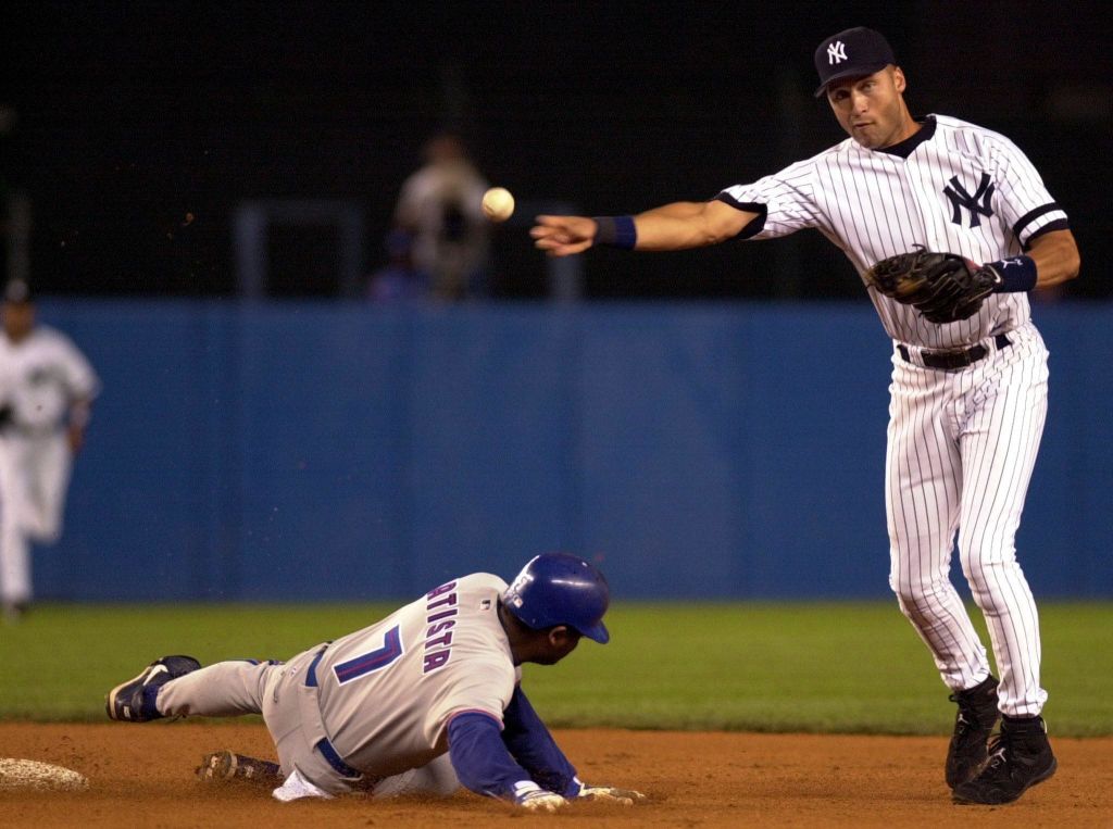 Derek Jeter throwing a baseball in a Yankees game