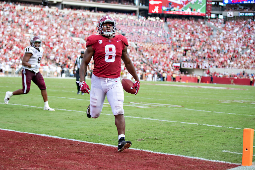Josh Jacobs finishing up a touchdown run at Alabama