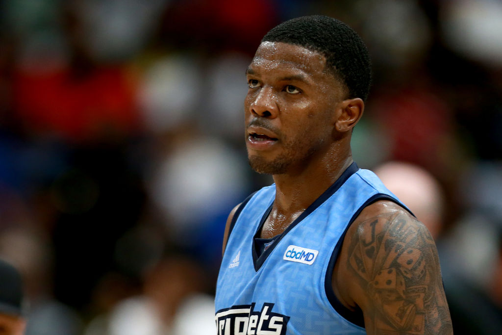 Joe Johnson #1 of the Triplets looks on