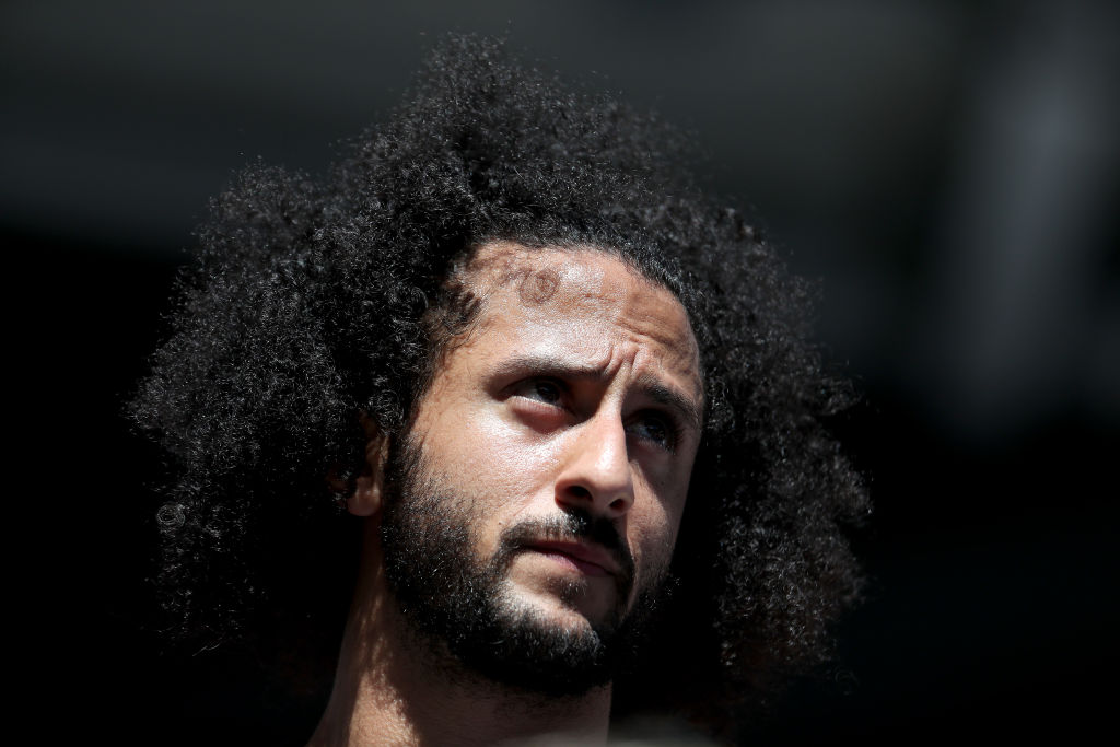Colin Kaepernick watches a Women's Singles second round match