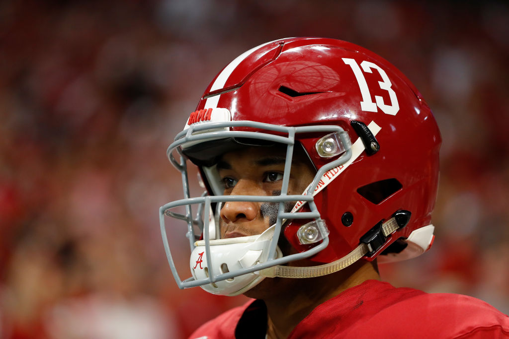 Tua Tagovailoa #13 of the Alabama Crimson Tide walks on the field