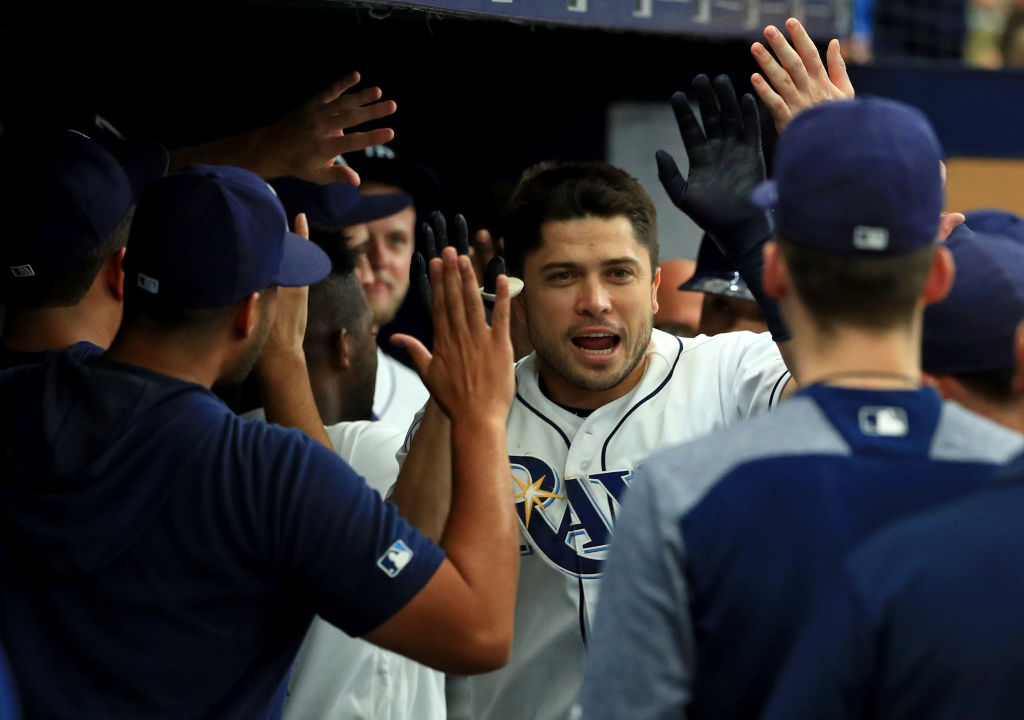 Travis d'Arnaud makes his rounds in the dugout