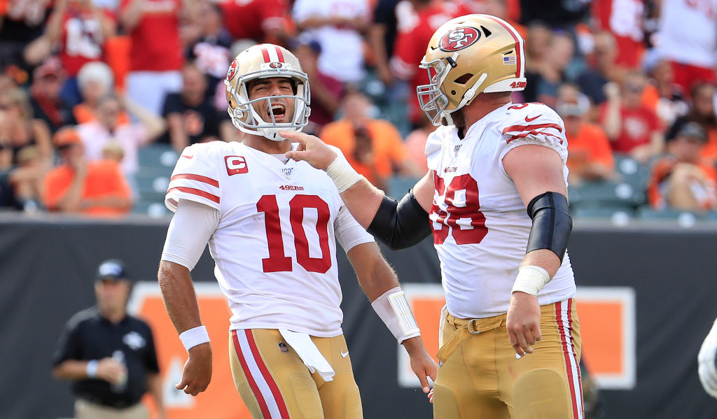 Jimmy Garoppolo and Mike Person enjoy the 49ers rout of the Bengals on Sept. 15, 2019.