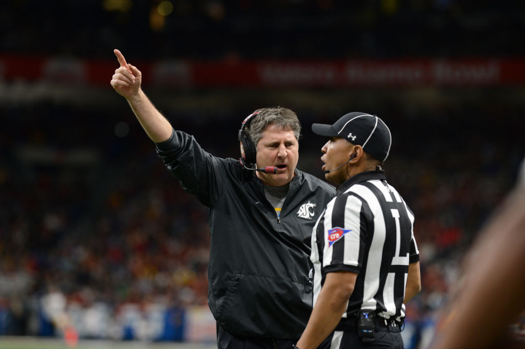 Washington State Cougars head coach Mike Leach yells at an official