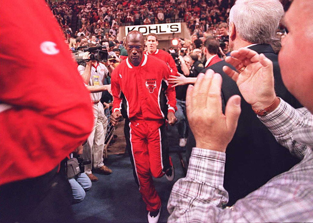 Chicago Bulls basketball star Michael Jordan runs onto the court