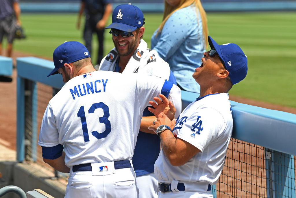 Dodgers manager Dave Roberts and players Clayton Kershaw and Max Muncy