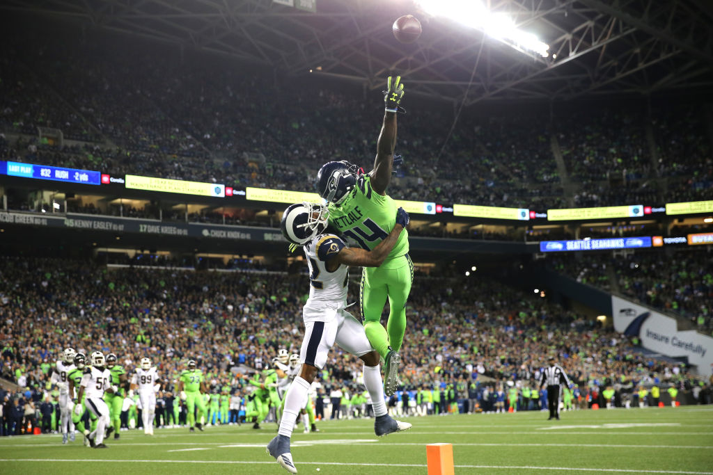 Seattle Seahawks receiver DK Metcalf uses his wingspan to reach for a Russell Wilson pass.
