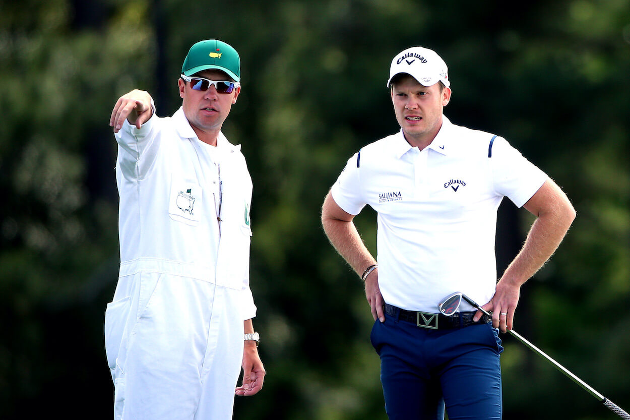 Danny Willett and Jonathan Smart talk during the 2016 Masters.