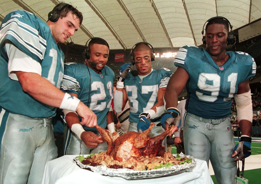 The Detroit Lions eat some turkey after a Thanksgiving Day NFL game.