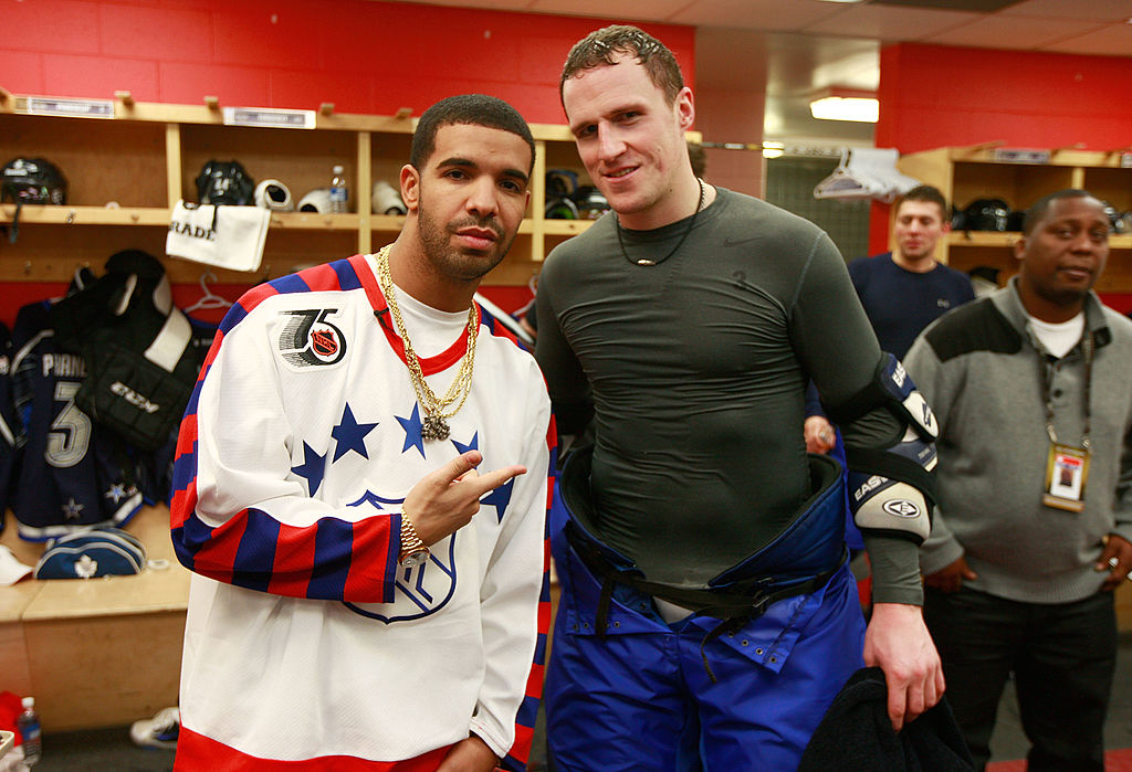 Rapper Drake visits Dion Phaneuf of the Toronto Maple Leafs in the locked room