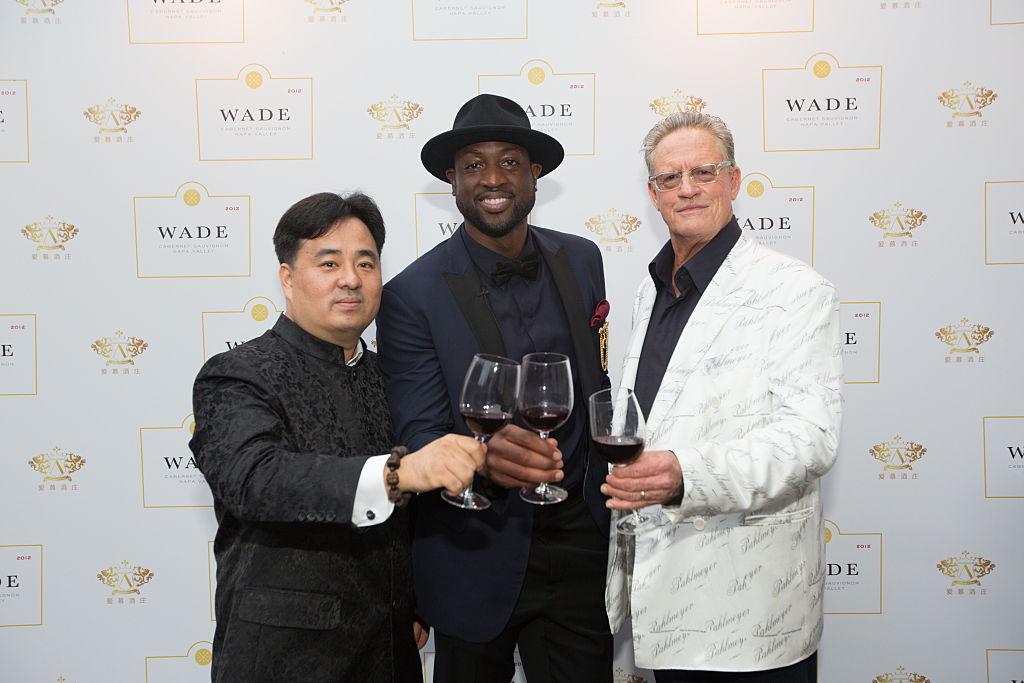 Nee Lau, Dwyane Wade and Jayson Pahlmeyer celebrate Wade's new wine label