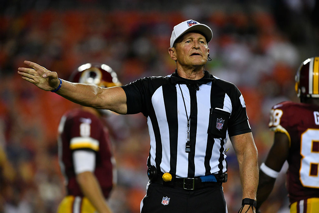 NFL referee Ed Hochuli announces a penalty.