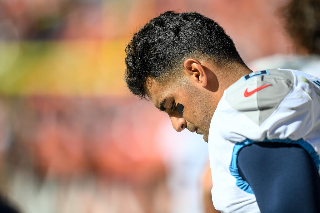 Marcus Mariota #8 of the Tennessee Titans stands in the bench