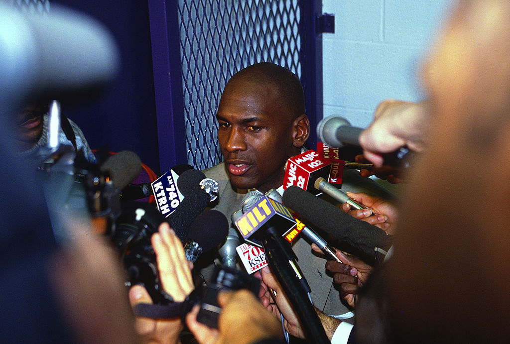 Michael Jordan of the Chicago Bulls talks with the media