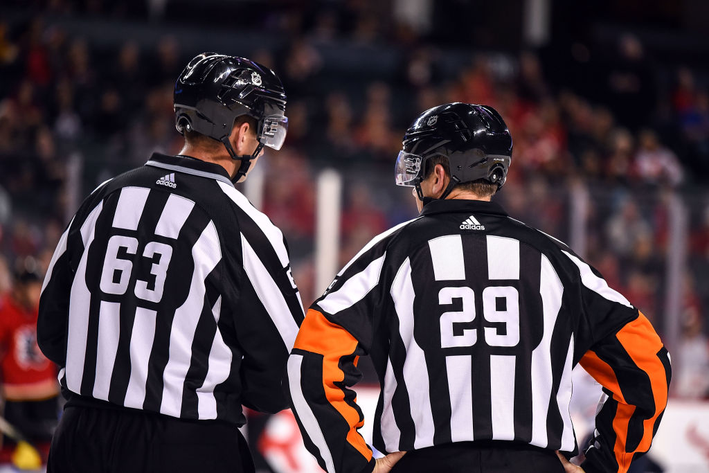 NHL Referees Trent Knorr (63) and Referee Ian Walsh (29)