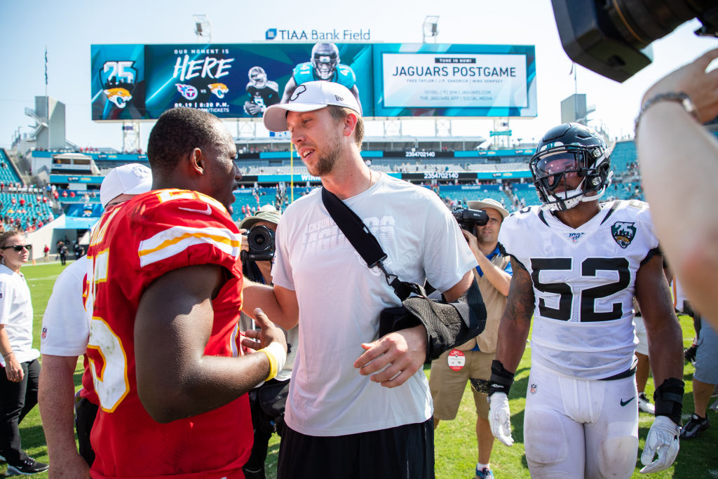 Nick Foles of the Jacksonville Jaguars meets with LeSean McCoy of the Kansas City Chiefs