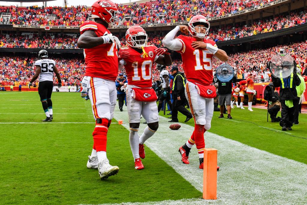 Pat Mahomes celebrating a touchdown with his teammates.