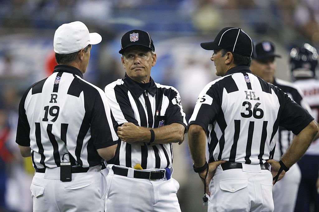 Referee Larry Rose helps Bruce Arians understand pass interference and other penalties.