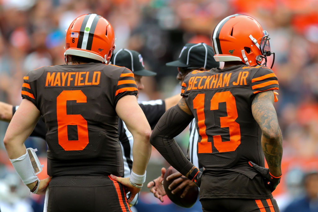 Cleveland Browns' stars Baker Mayfield and Odell Beckham standing on the sideline.