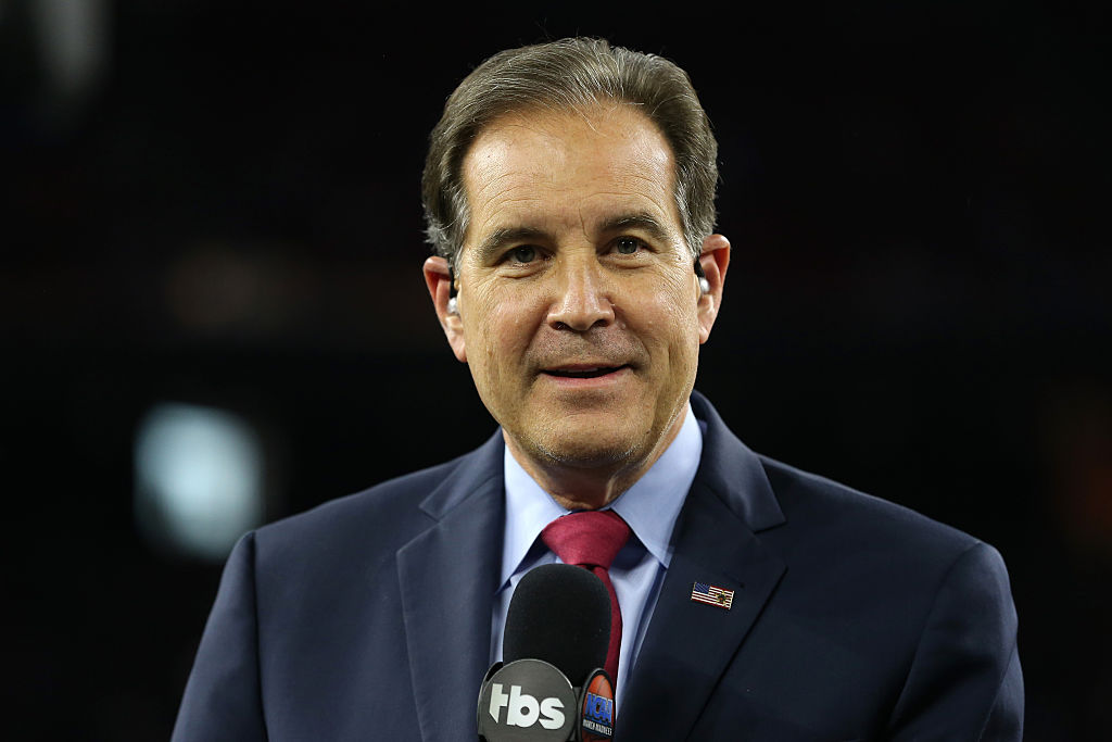 Jim Nantz talks into a microphone during a sports broadcast.