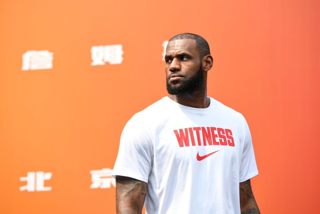 LeBron James wearing a Nike shirt at a press event.