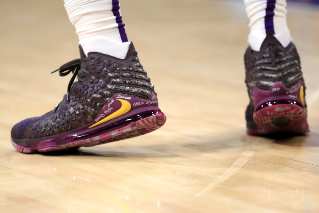 A close up of LeBron James' shoes during a game.