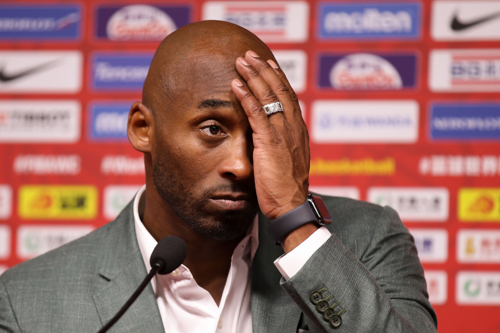 Former NBA player Kobe Bryant talks to the media