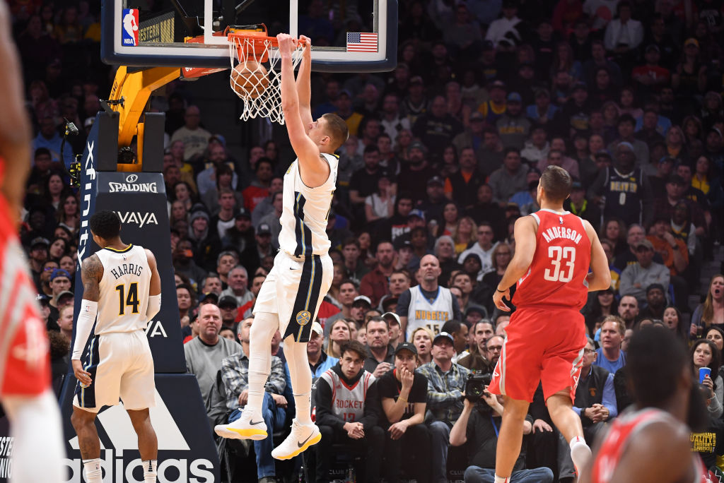 Nikola Jokic finishes up the play with a slam dunk