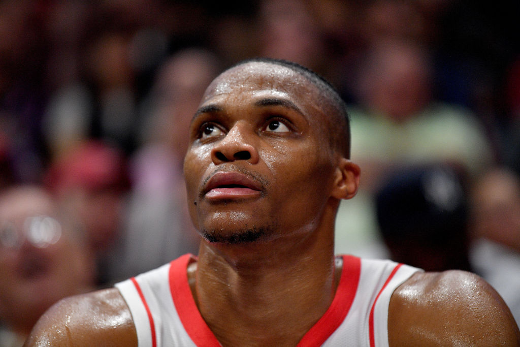Rockets' guard Russell Westbrook looks on from the bench.
