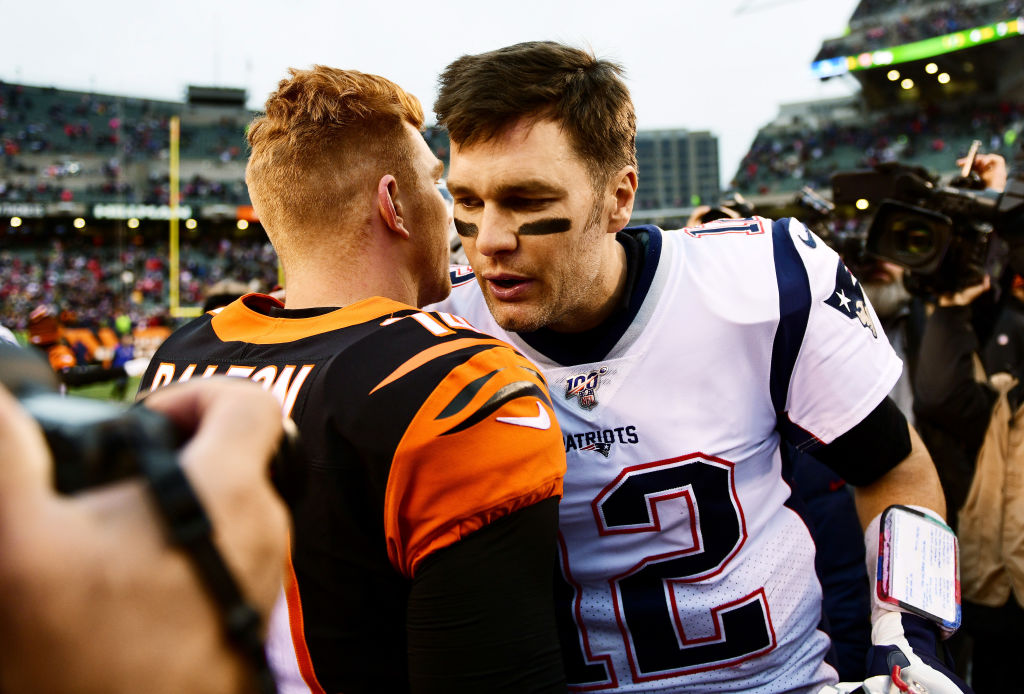 Andy Dalton of the Cincinnati Bengals shakes hands with Tom Brady of the New England Patriots